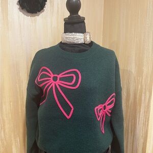 Elegant Dark Green Sweater with Pink Bow Accents